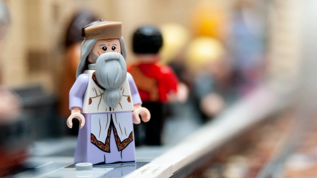 A Lego minifigure of the fictional character Professor Dumbledore from the Harry Potter series.