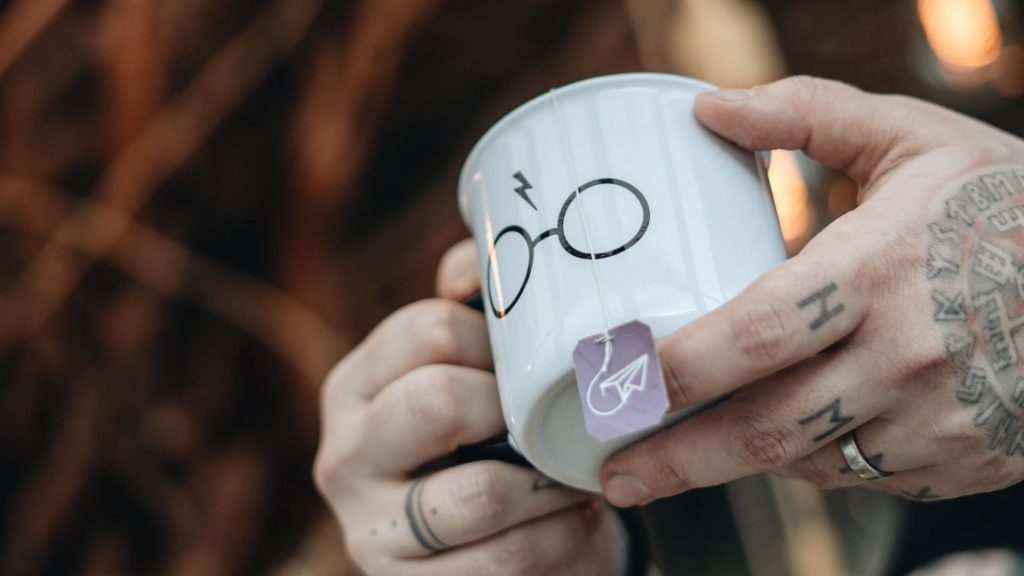 A mug featuring Harry Potter-themed design elements, perfect for fans of the series.